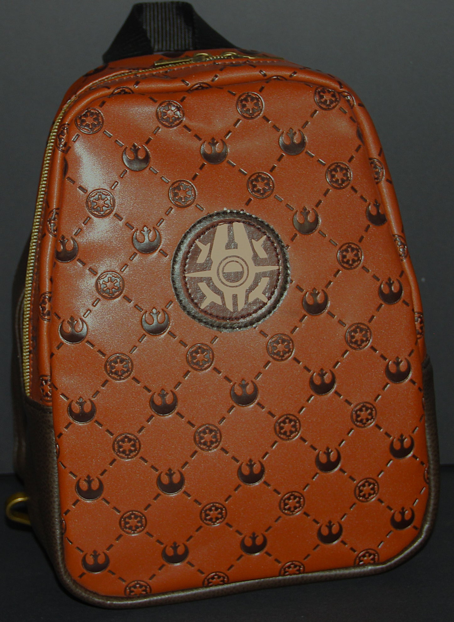 Scoundrel Symbol Medallion featured on Brown on Dark Brown Debossed Quilted Look Faux Leather Unisex Sling Bag